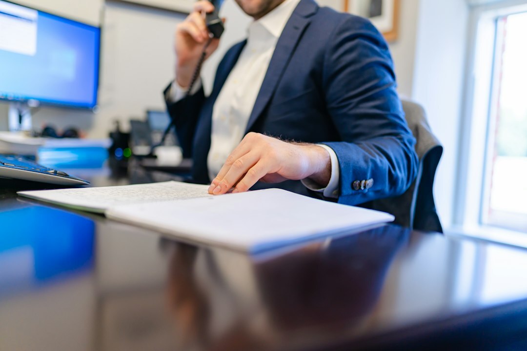 person reviewing documents at desk