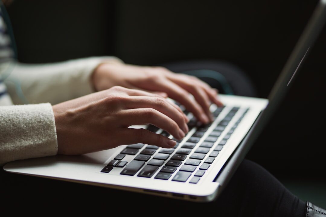 person using laptop for insurance