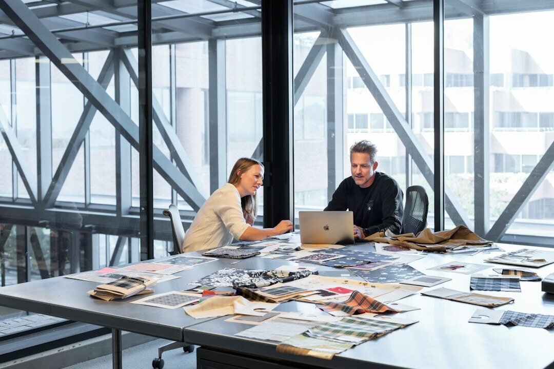 Diverse insurance team meeting around a table in a Singapore office