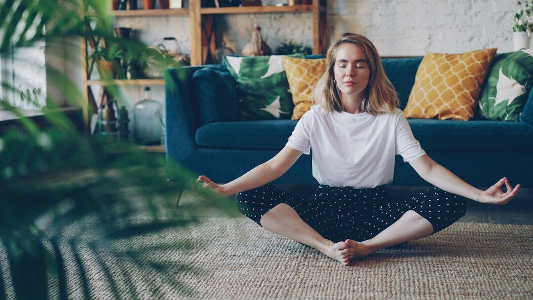person meditating in calm room