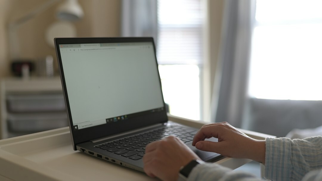 person using laptop at home