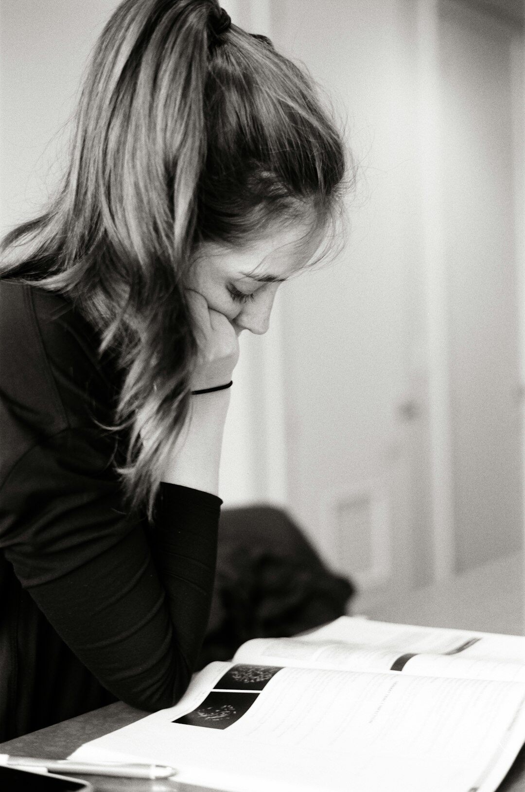 person reviewing documents at desk